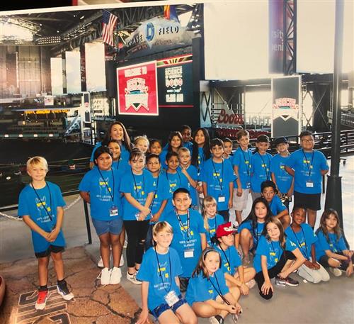 Students in blue shirts on a field trip to Chase Field Arizona